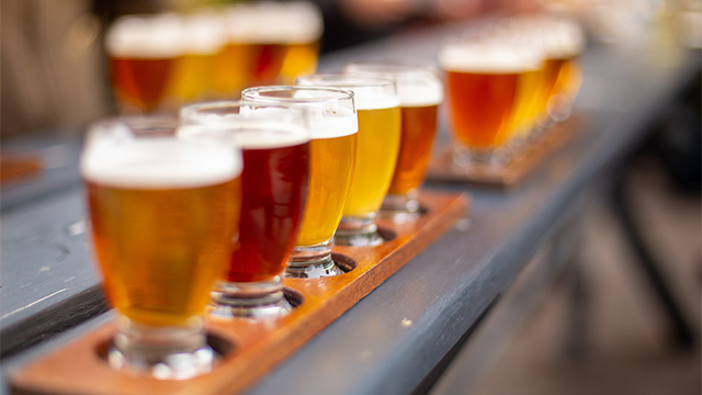 Line of beers on wooden table