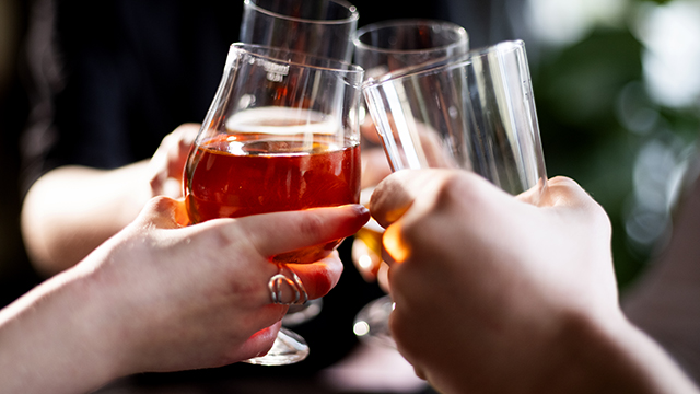 Close up shots of glass collisions with beer