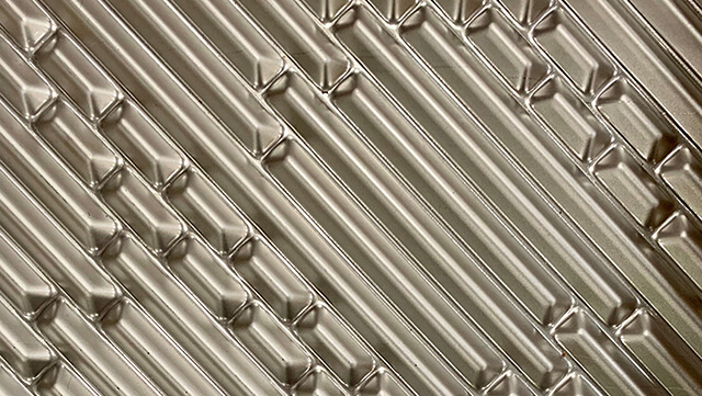 motif Xcore pour des plaques solides et résistantes aux hautes pressions